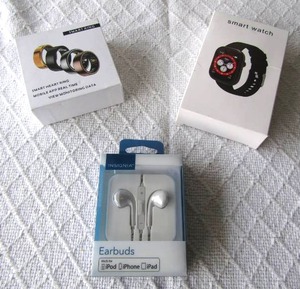 lot 510 image: Smart watch, Smart ring, Insignia earbuds for iPod, iPhone, iPad