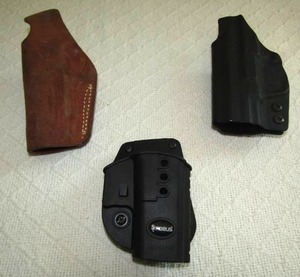 lot 553 image: Pistol holsters including Fobus GL-2-ND for Glock, Leather hoslter and hard shell holster
