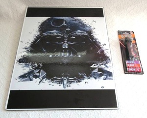 lot 556 image: Star Wars Darth Vader placard art and Darth Vader Pez in blister pack