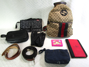 lot 563 image: Gucci backpack, purses, leather belts and more as shown