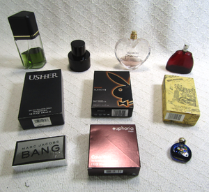 lot 580 image: Assorted colognes and perfumes plus name brand boxes (Boxes are empty)