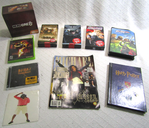 lot 581 image: X box game, Michael Jackson special edition magazine, Magma Wyvern puzzle and more