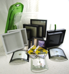 lot 582 image: Assorted photo frames and Sterilite storage tote with lid