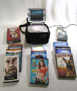 lot 593 image: Go Vision DVD travel theater kit with DVD and VHS movies as shown