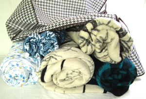 lot 597 image: Assorted fleece throw blankets (5) some Made in Germany, also includes storage bag