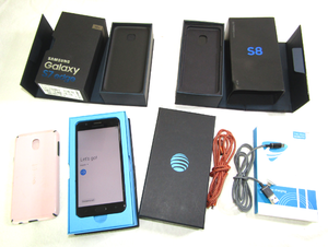 lot 629 image: Samsung Galaxy J7 cell phone (Powers on), plus empty boxes & power cords