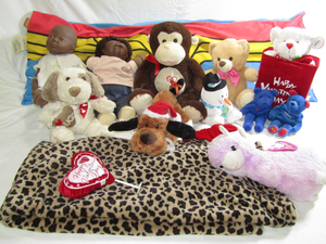 lot 558 image: Wonder Woman long pillow, Retro Cabbage patch Kids doll and assorted stuffed animals as shown