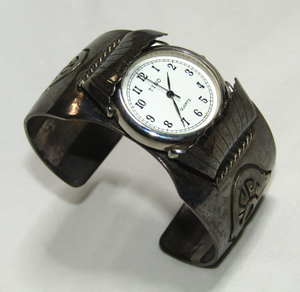 lot 640 image: Sterling silver (marked STERLING) cuff style watch band with Tino quartz watch