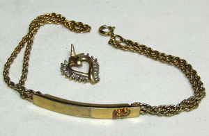 lot 644 image: 10k Gold jewelry (marked 10k) Heart pendant with diamond chip gemstones, bracelet with black hills gold leaf