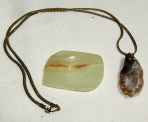 lot 646 image: Geode crystal stone pendant necklace and a worry stone