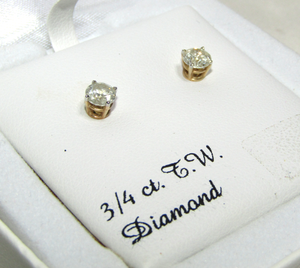 lot 648 image: 34 ct T.W. Diamond earings in 14k gold post (marked 14k), in gift box