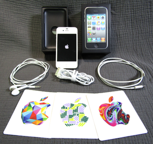 lot 636 image: Apple iPhone 4S model A1387 (Powers on), includes charge cord, decals, box, ear buds