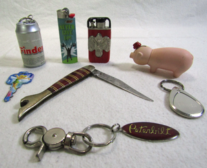 lot 638 image: Retro Kco knife with ladys boot bottle opener, assorted lighters and keychains as shown