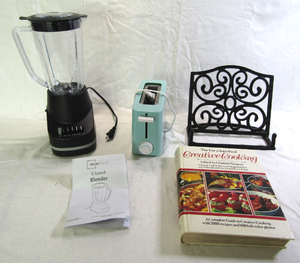 lot 692 image: Mainstay 6 speed blender, Single toaster, Creative cooking cook book and book stand