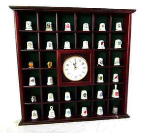 lot 678 image: Ceramic thimble collection in display shelf with clock