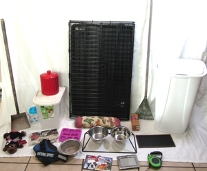 lot 514 image: Best pet supplies dog waste bags, biscuit container, and play mat