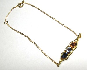 lot 722 image: .925 Silver gold plated vermeil bracelet (marked .925) with glass gems
