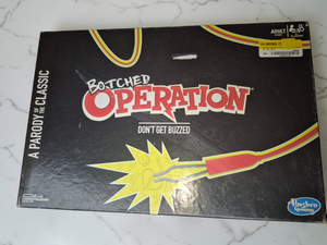 lot 32 image: Board Game Lot  Operation, Trivial Pursuit DVD, Zombie-Opoly, Labyrinth & Golf-Opoly