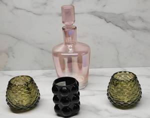 lot 68 image: Colored Glass Dcor Set  Pink Bottle Decanter & Textured Candle Holders (4)