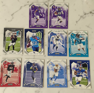 lot 115 image: 2021 Panini Playoff NFL Card Lot (10)  7 ROOKIES  Etienne RC, Barkley, Carr  Starter Set  Resale Lot