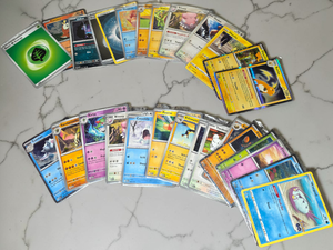 lot 119 image: Pokmon Card Lot (28 Cards)  Pikachu Reverse Holo, Fuecoco Holo, Starters, 20202024
