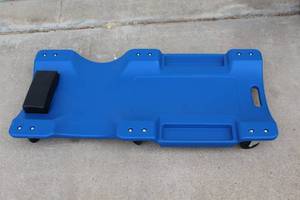 Blue low-profile, plastic mechanic's creeper