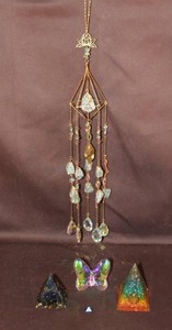 lot 36 image: handmade energy pyramids and crystal suncatcher.