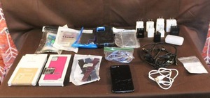lot 61 image: Phone accessories and a iPhone didnt have a charger to test the phone so  untested