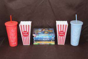 lot 127 image: Kids DVDs popcorn containers and to unused cups with lid and straw