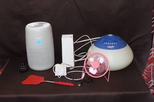 lot 134 image: Levoit Air Purifier White metal desk fan and Equate Warm Mist Vaporizer and more see pictures for details