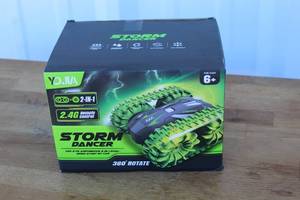 lot 166 image: YOJIA Storm Dancer rechargeable remote control stunt car.
