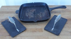 lot 168 image: Cast iron pan and stainless steel spring handle press