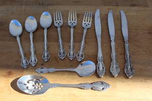 lot 183 image: vintage flatware set, identified as the Oneida Michelangelo pattern, likely crafted from high-quality stainless steel