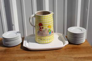 lot 208 image: Block Spal Portugal plates and micro-browner serving tray and Pottery pitcher features a yellow and white checkerboard pattern with a charming Happy Time scene of children playing in the sand