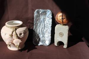 lot 227 image: handmade, boho chic pottery urn featuring braided twine detailing wrapped around the neck and decorative clay charms. And vintage Arthur Court aluminum serving tray and artistic, handcrafted decorative table clock featuring a stone