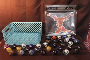 lot 262 image: miniature NFL football helmets,