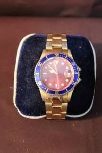 lot 269 image: Rolex watch missing the wind up thing on the side but is working authenticity unknown