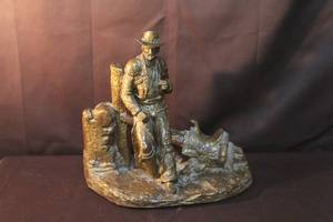 lot 290 image: collectible western-themed sculpture has a few small chips on the back of his hat see pictures