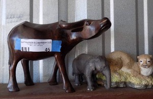 lot 45 image: wooden animal and elephant figurine and otter dcor