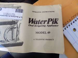 lot 69 image: waterpik oral irrigating appliance model 49