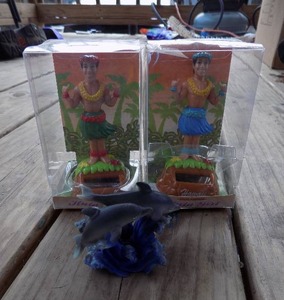 lot 112 image: KC HAWAII SHAKA HULA MAN SOLAR DASHBOARD DOLLS  QTY 2   & DOLPHIN SCULPTURE