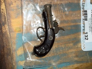lot 132 image: pirate gun lighter