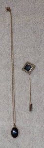 lot 80 image: VINTAGE MARCASITE & BLACK STICKPIN,   BLACK ONXY LOCKET ON CHAIN