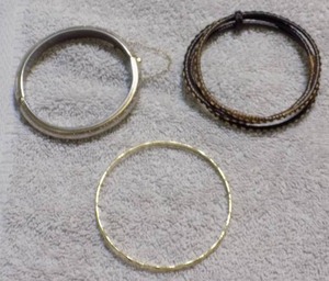 lot 65 image: 3 BRACELETS , SILVER , GOLD AND WOOD