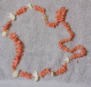 lot 19 image: PEACH COLORED CORAL BRANCHY NECKLACE WITH CARVED CORAL ELEPHANT
