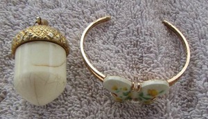 lot 57 image: SMALL BUTTERFLY BRACELET AND PERFUME ACORN