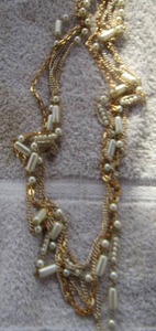 lot 69 image: 4 STRAND GOLD AND PEARL 28 NECKLACE
