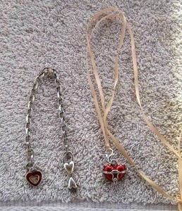 lot 8 image: HEART BRACELET AND RED HEART LOCKET