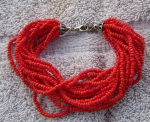 lot 121 image: TINY BEAD CORAL MULTIPLE  STRAND BRACELET