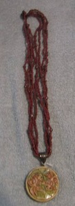 lot 97 image: FISH CARVING ON BONE NECKLACE